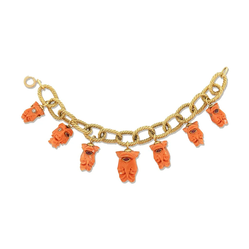 Coral Mask Charm Bracelet, circa 1960