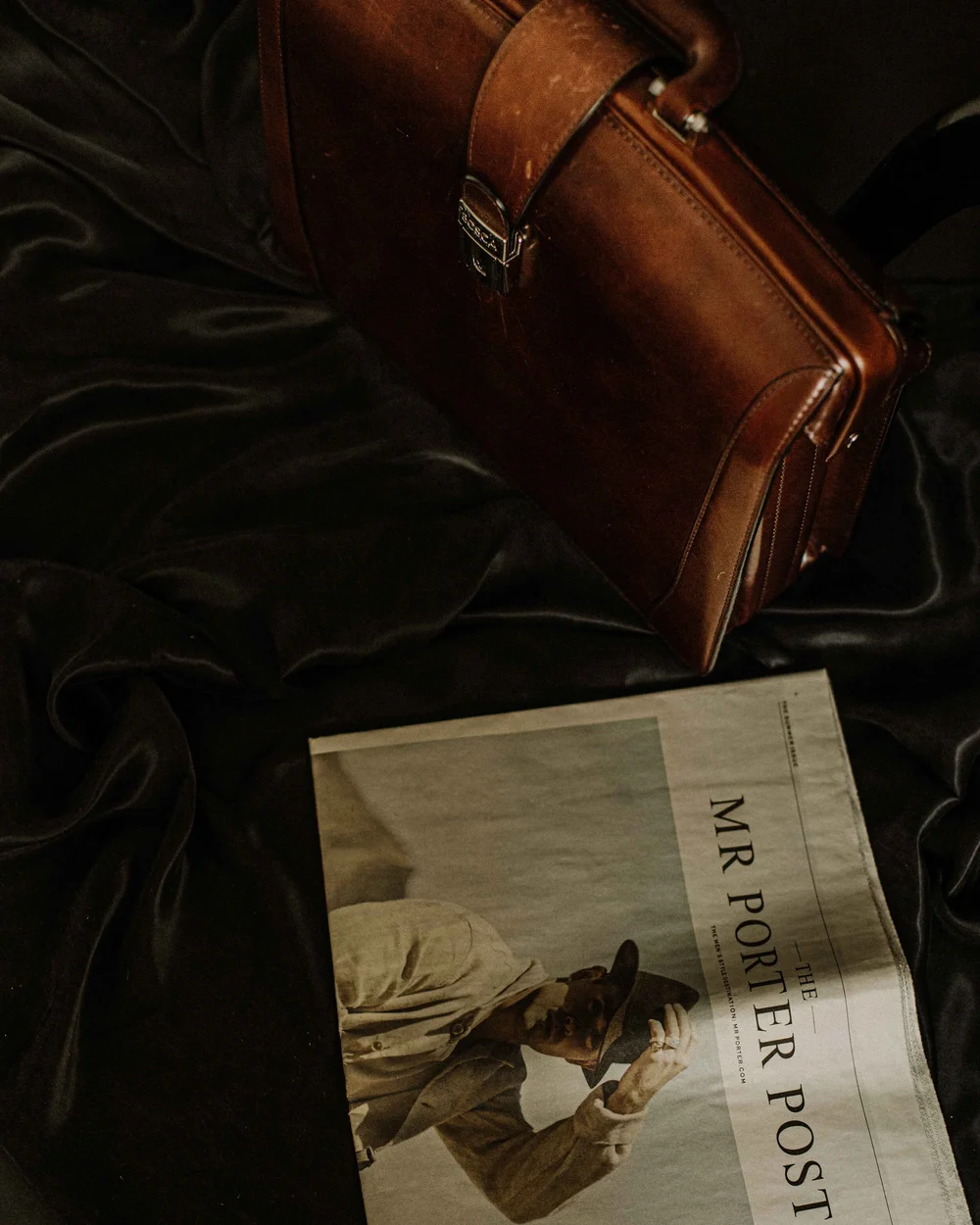 Leather briefcase and menswear journal, custom business suits Calgary