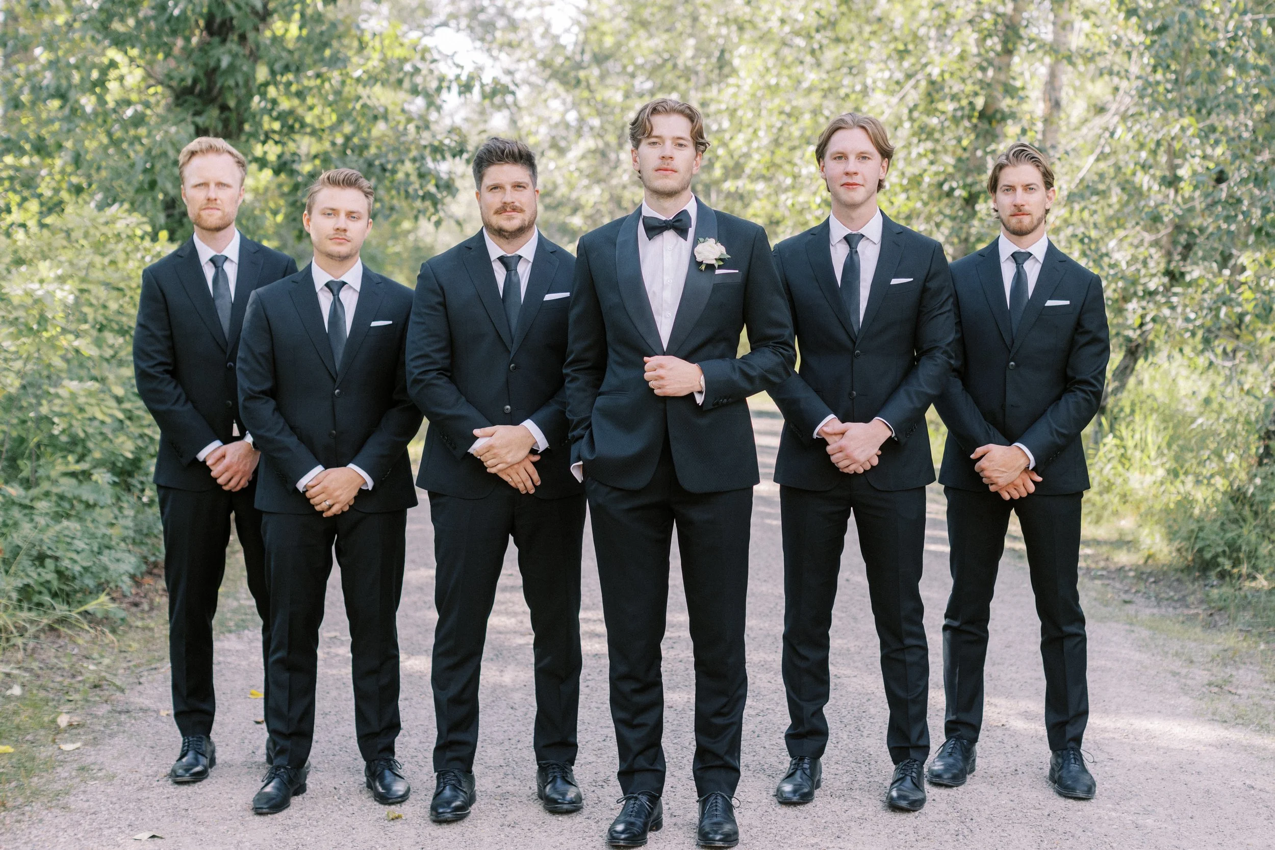 Groom and groomsmen in matching custom suits