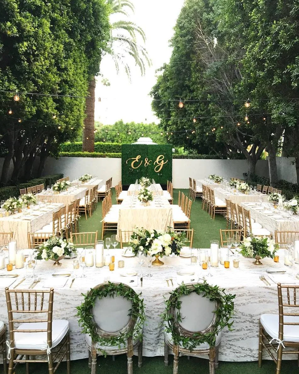 "Custom hedges, parlor and chiavari chairs and a fun linen - everything we love in a photo!" - Signature Party Rentals