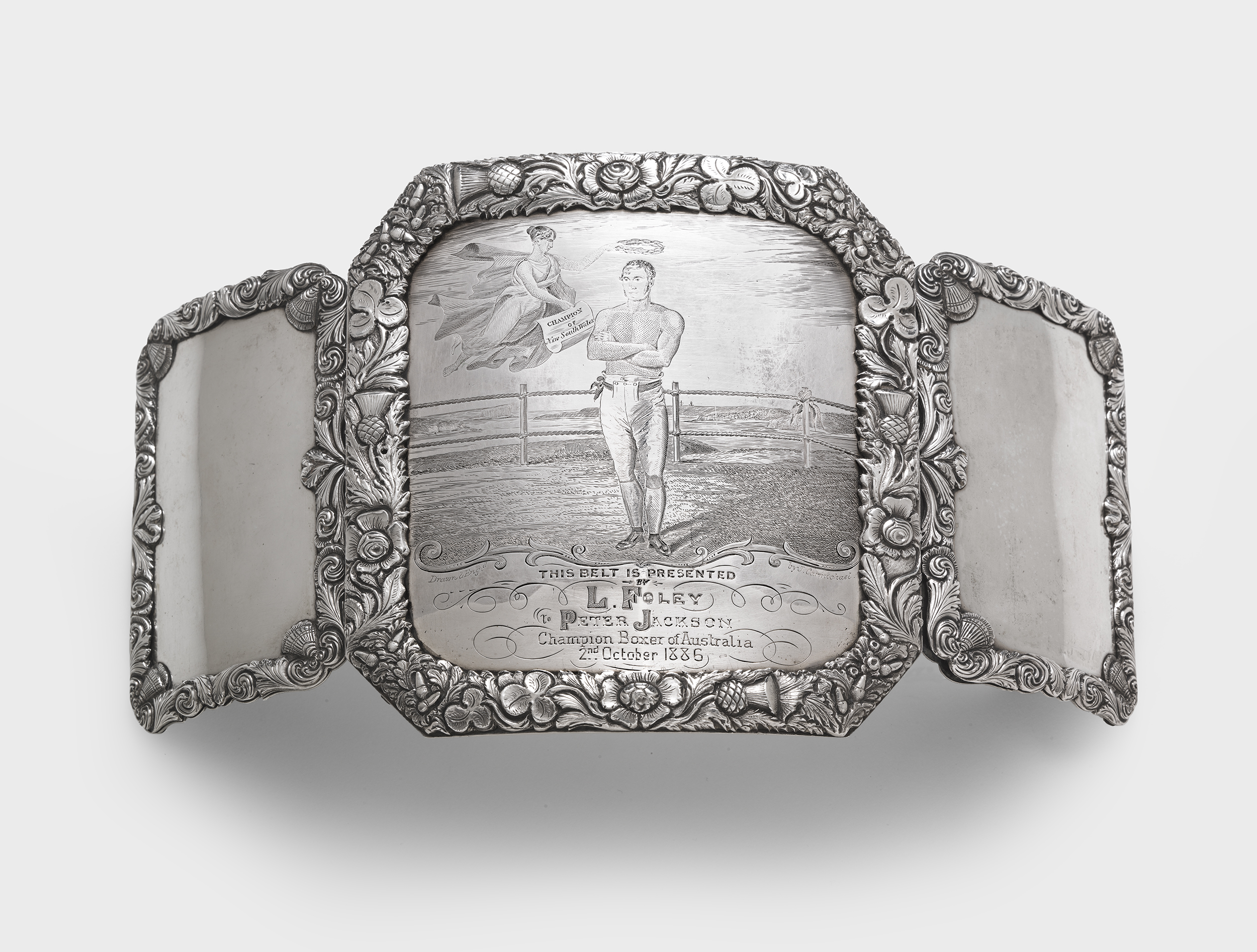   John Cohen  (silversmith) and  John Carmichael  (engraver). Presentation champion's boxing belt buckle 1839-1847 sterling silver: fabricated, stamped, repousséed, chased, engraved. &nbsp;National Gallery of Australia, Canberra. &nbsp;Purchased 2014