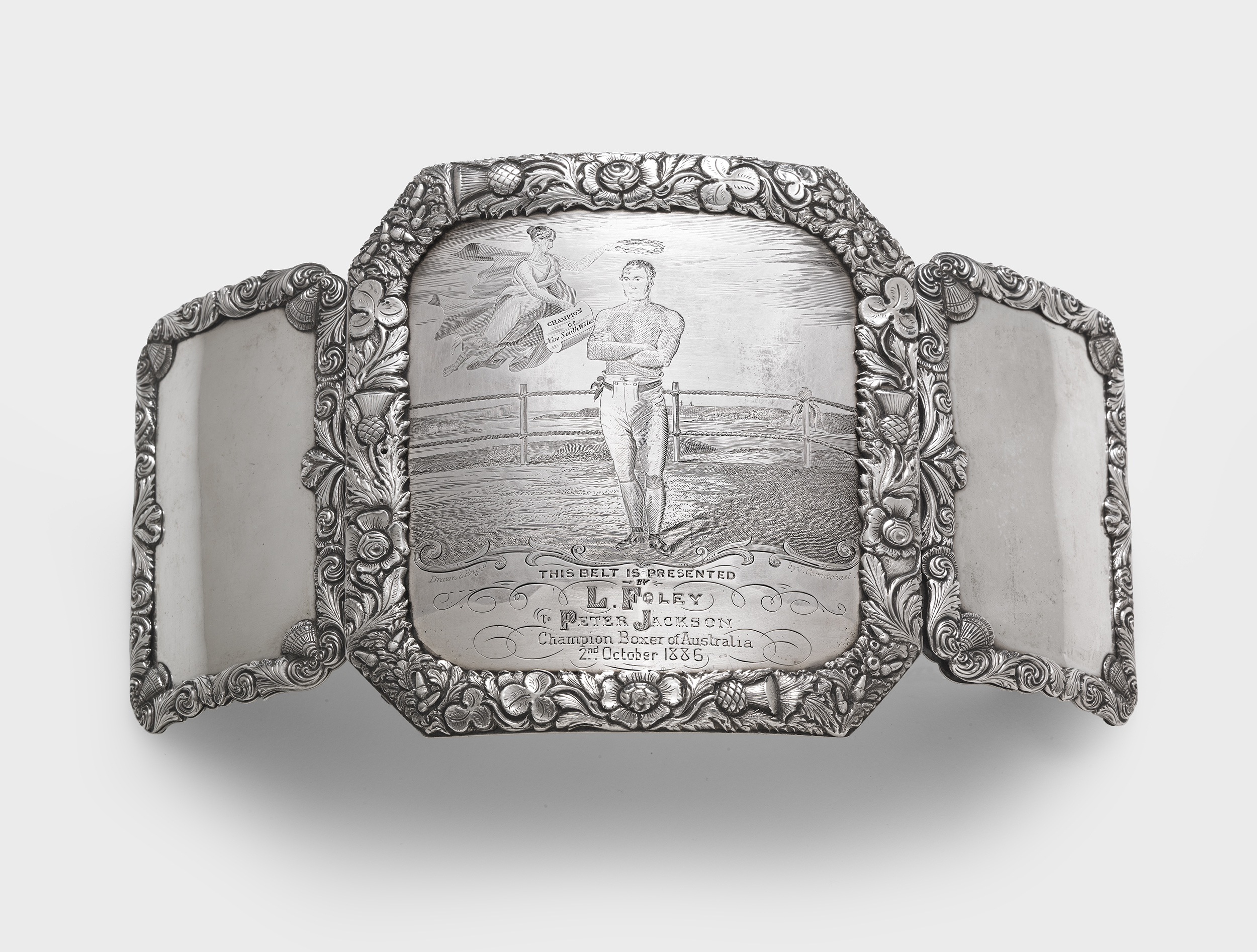   John Cohen  (silversmith) and  John Carmichael  (engraver). Presentation champion's boxing belt buckle 1839-1847 sterling silver: fabricated, stamped, repousséed, chased, engraved. &nbsp;National Gallery of Australia, Canberra. &nbsp;Purchased 2014 