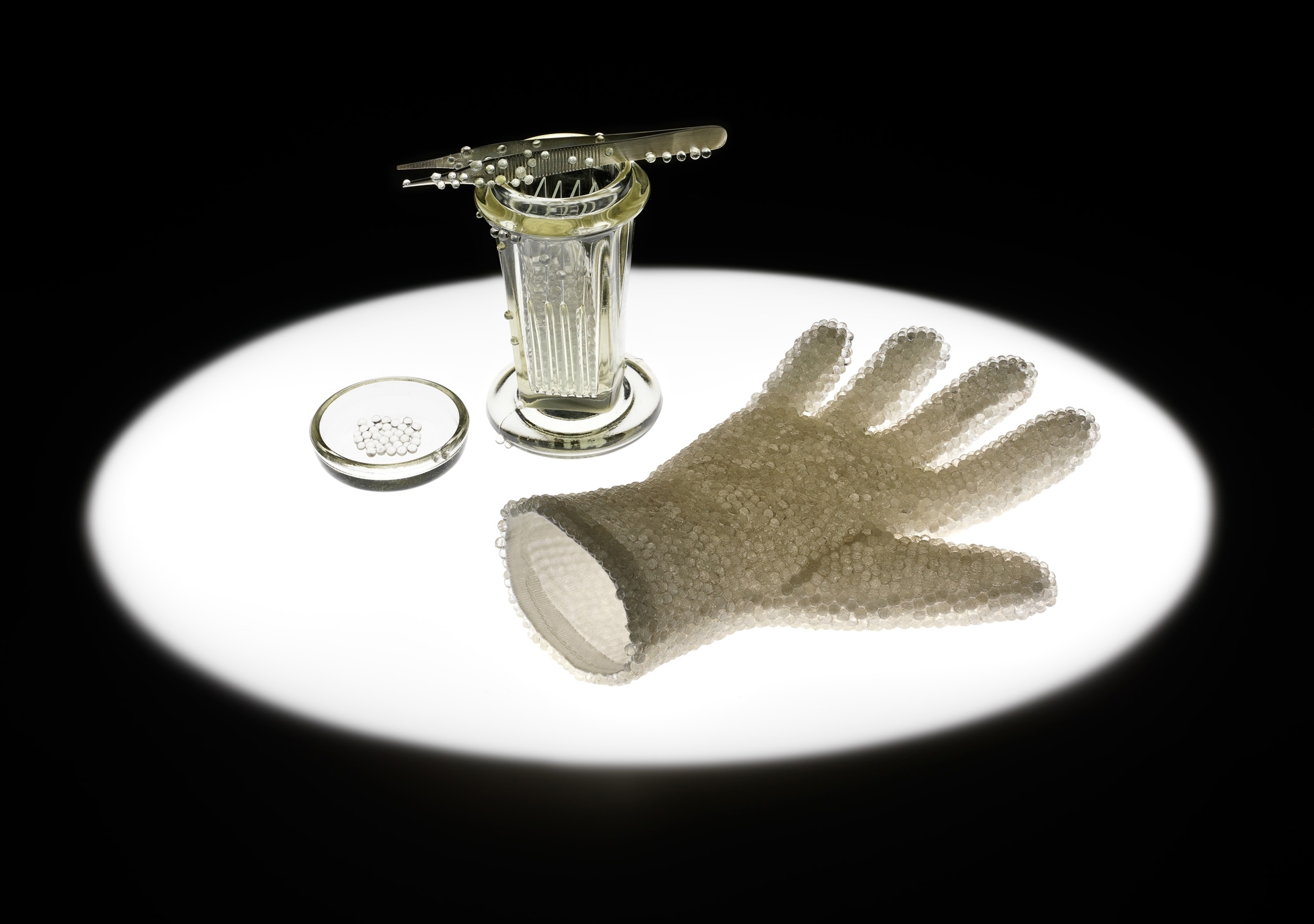  Catherine Truman,  In Preparation for Seeing : Cell Culture Glove , 2015, white cotton glove encrusted with glass spheres, Coplin jar, microscope slides, steel forceps inlaid with glass spheres, light pad, dimensions variable. Image Grant Hancock.  