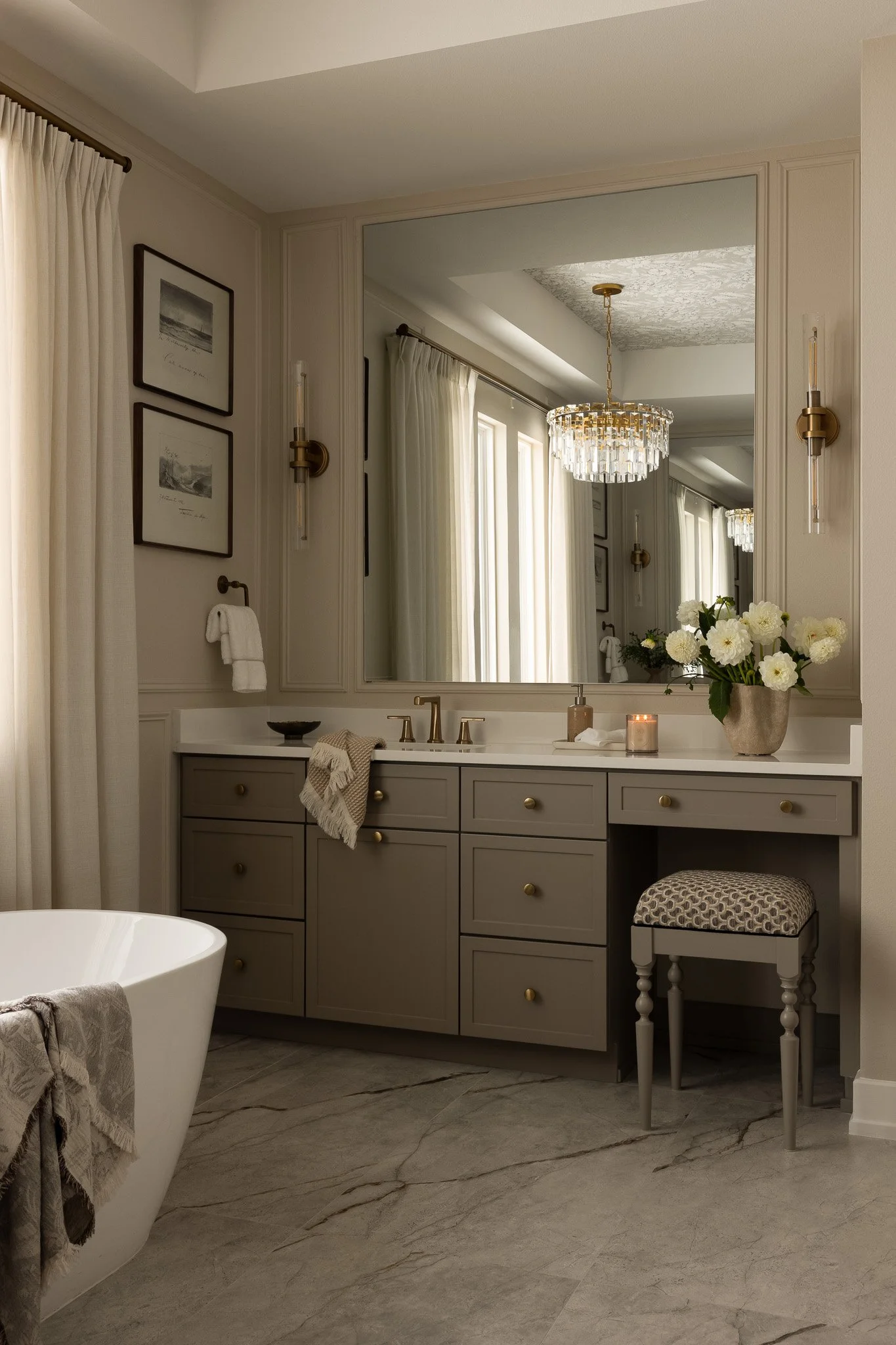 An elegant and sophisticated bathroom design with taupe cabinetry, romantic details and serene luxury feel.