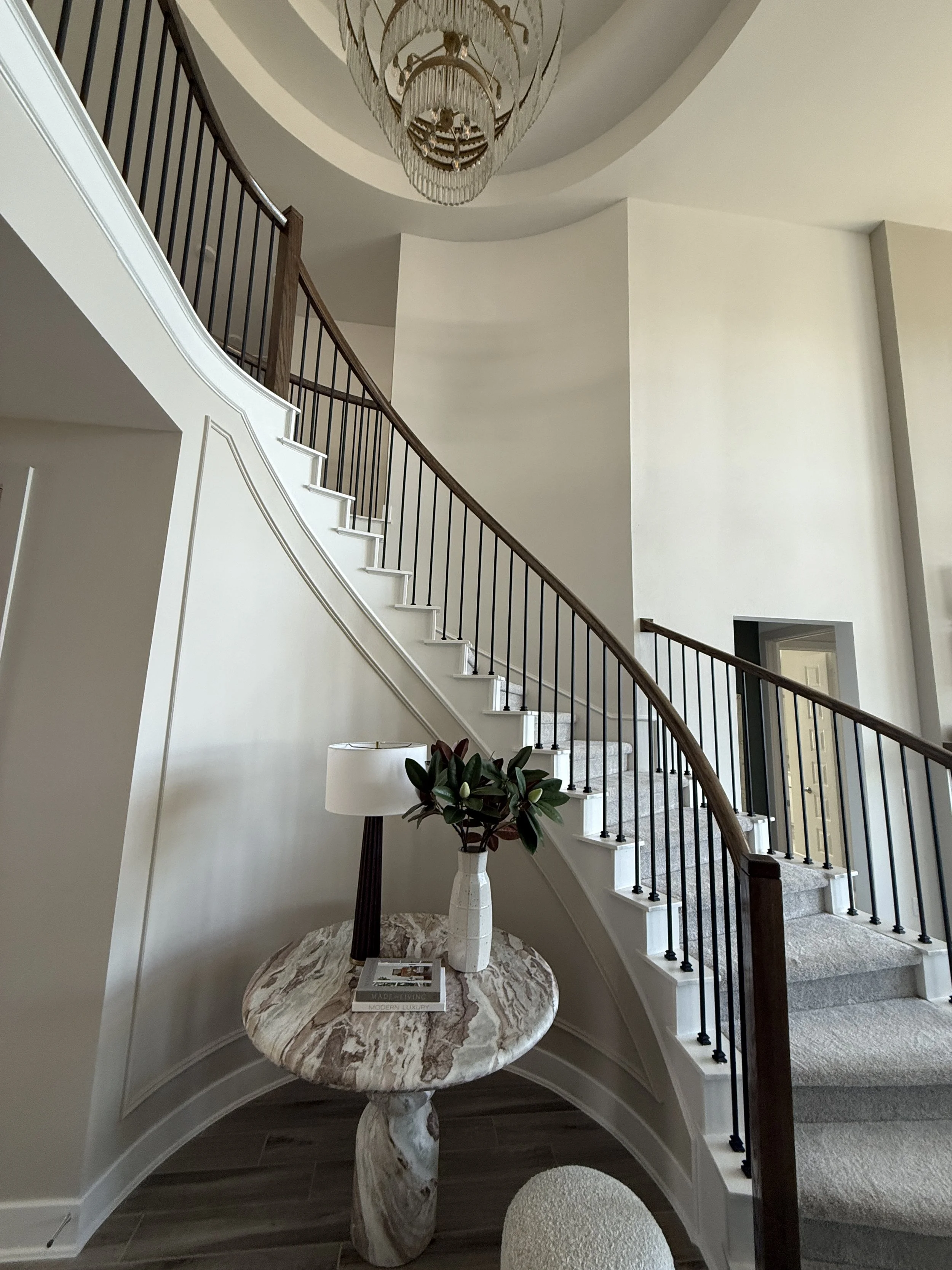 Curved staircase before interior design transformation