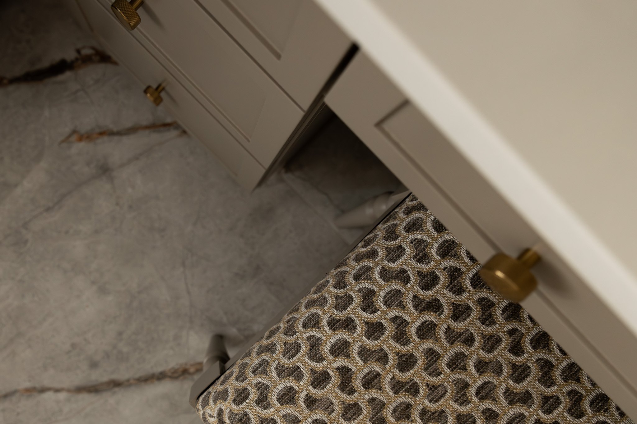 A close up shot of bathroom materials featuring flooring, fabrics, cabinetry and countertop materials.