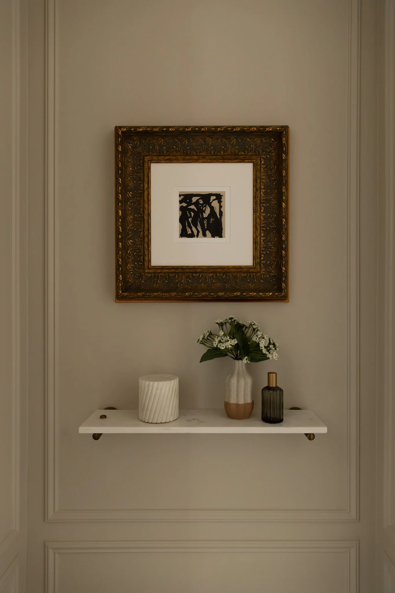 Storage above the toilet. Marble shelf above the toilet area for extra storage.