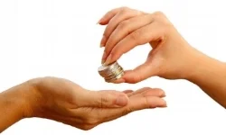 womans_hand_passing_stack_of_coins_to_another_hand.jpg