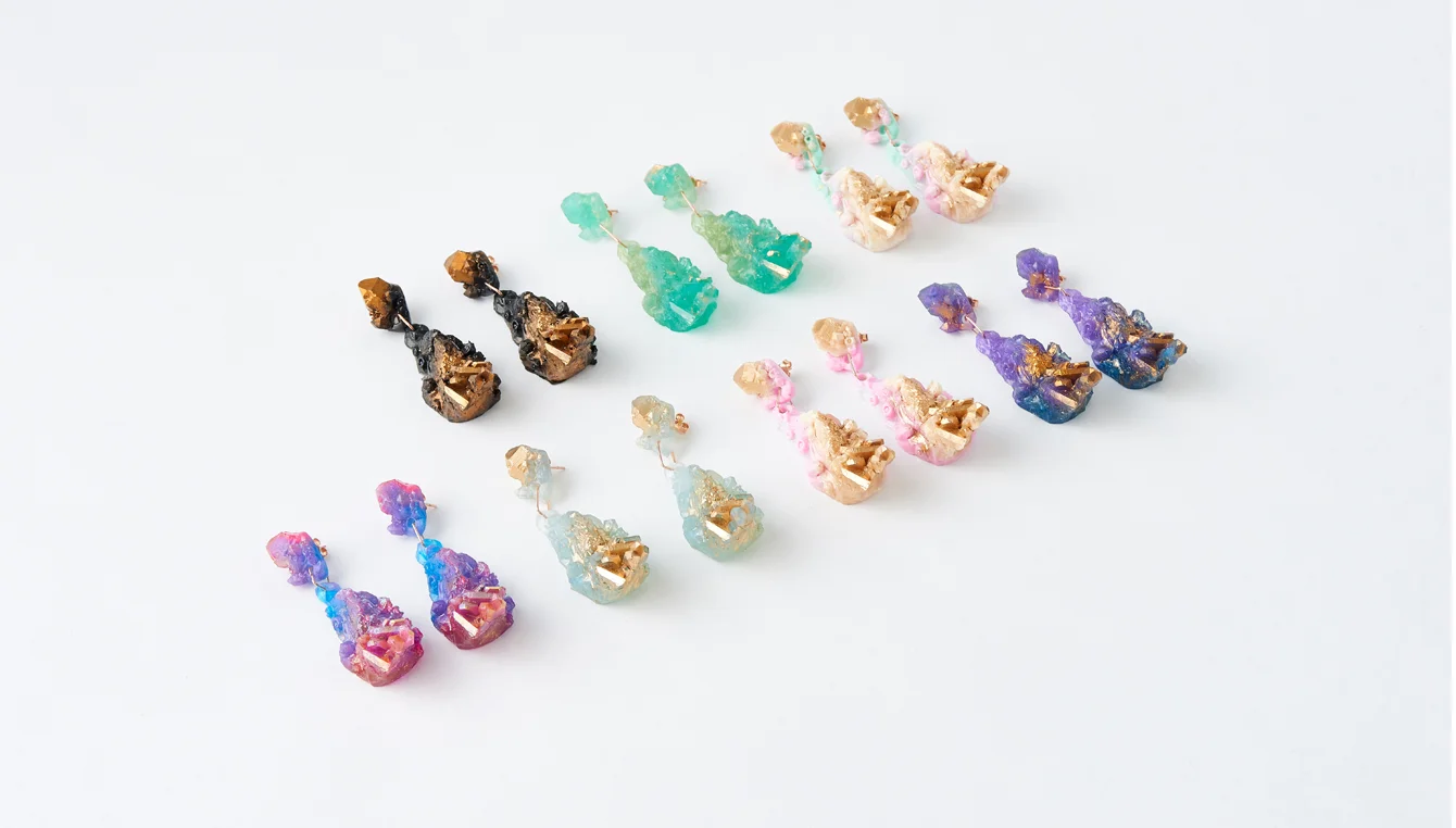 Chrysalis Drop Earrings, debut Geo-Alchemy collection, 2016. Resin & rose gold. Image courtesy NGV design store. Styling: Natalie Turnbull. Photography: Tomas Friml.