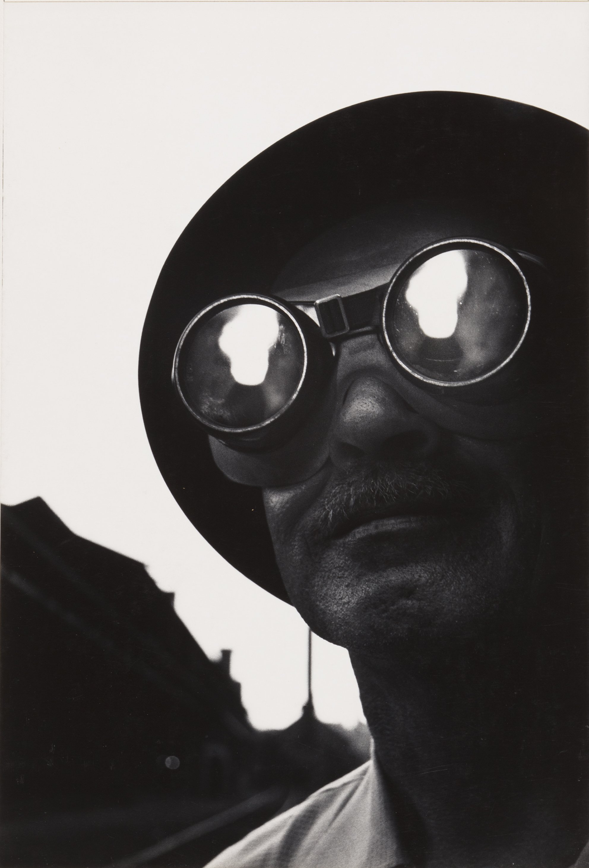 13. W. EUGENE_SMITH_Steelworker with goggles, Pittsburgh.jpg