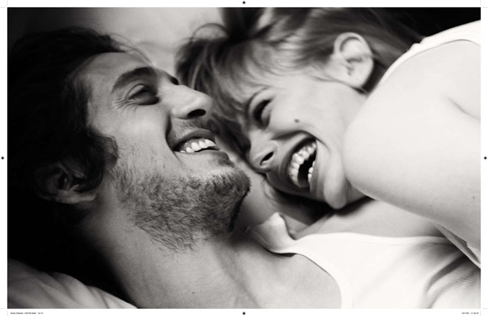 in-bed-couple-laughing-love.jpg