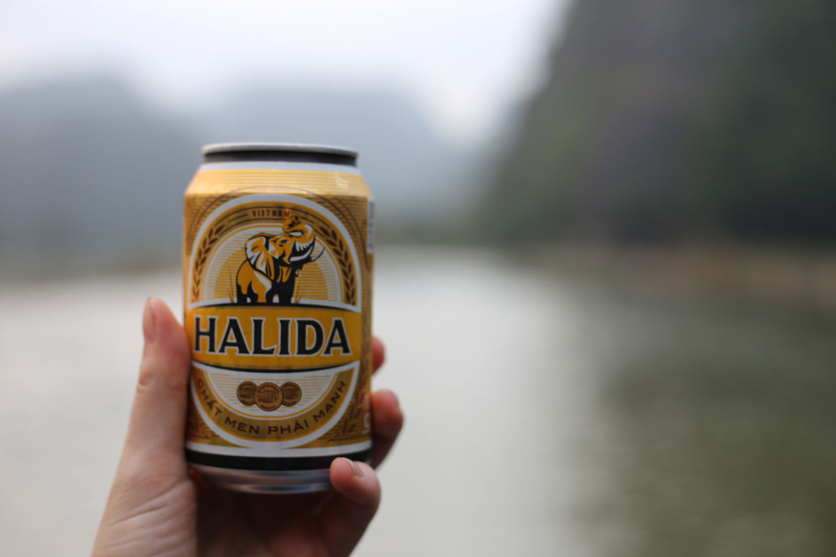 Romantic boat ride for two at Tam Cốc with my date Halida, a commercial beer available in Vietnam.
