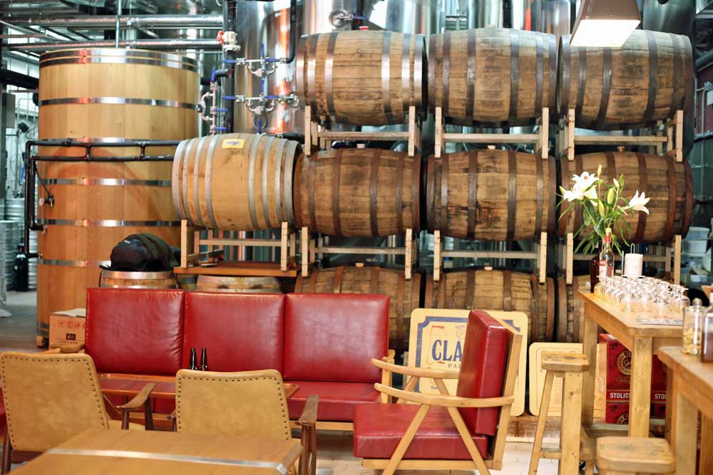 A tasting room separated from the brewery by a few barrels. Good vibes.