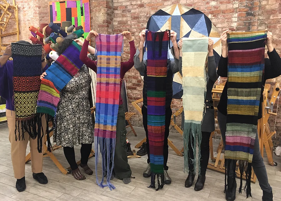 portrait of students with their woven work, Textile Arts Center, 2018
