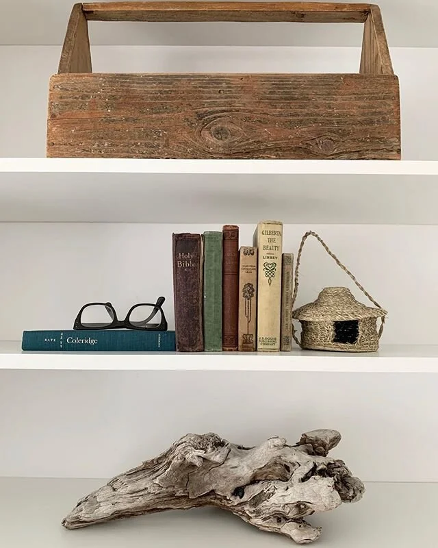 A Good Friday shelfy...full of treasured items. A toolbox from our visit to New Orleans, my father in laws old glasses, a bible from an old vacant church in Ireland, a woven birdhouse from Dans time in Africa, driftwood from a family beach trip. What