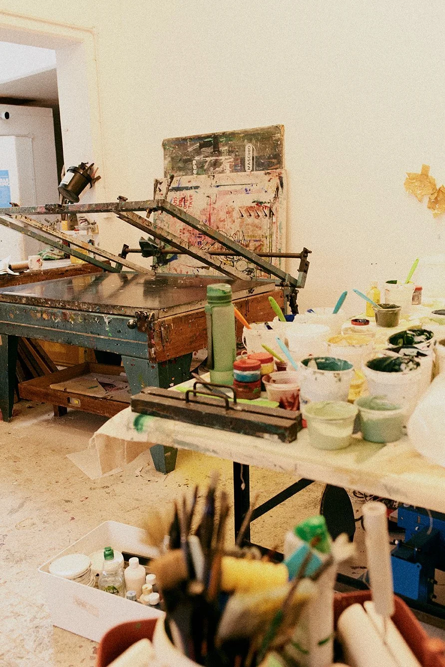 Image of an artist's studio showing the screen printing process