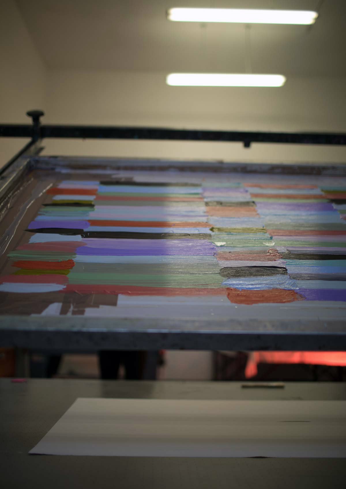 Screens, prints, materials and unfinished ideas in the studio.