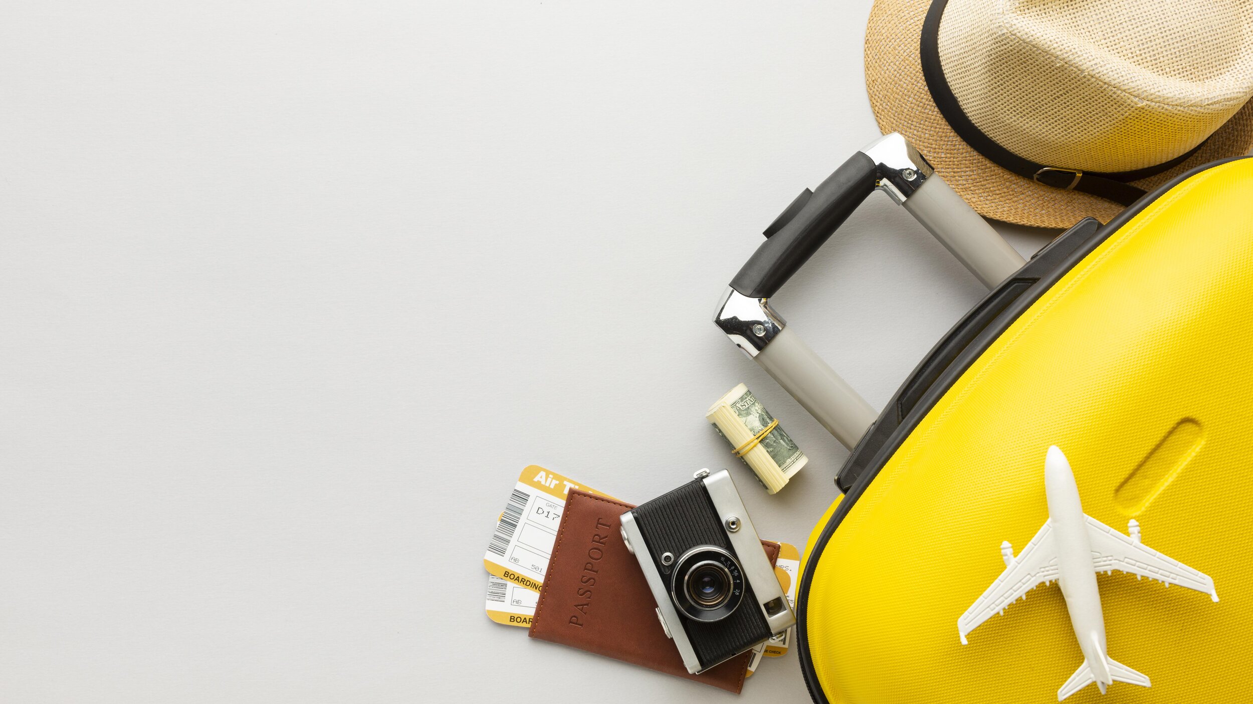 flat-lay-yellow-luggage-with-copy-space.jpg