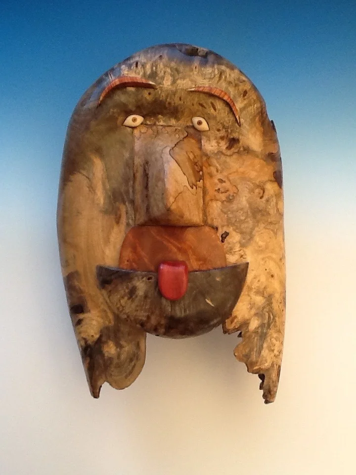 "Defiant One" Buckeye Burl, Tulipwood, Amboyna Burl, Maple Burl Tongue: Pink Ivory maple Eyes: Holly, Walnut, and Ebony 5” x 10” x 16”