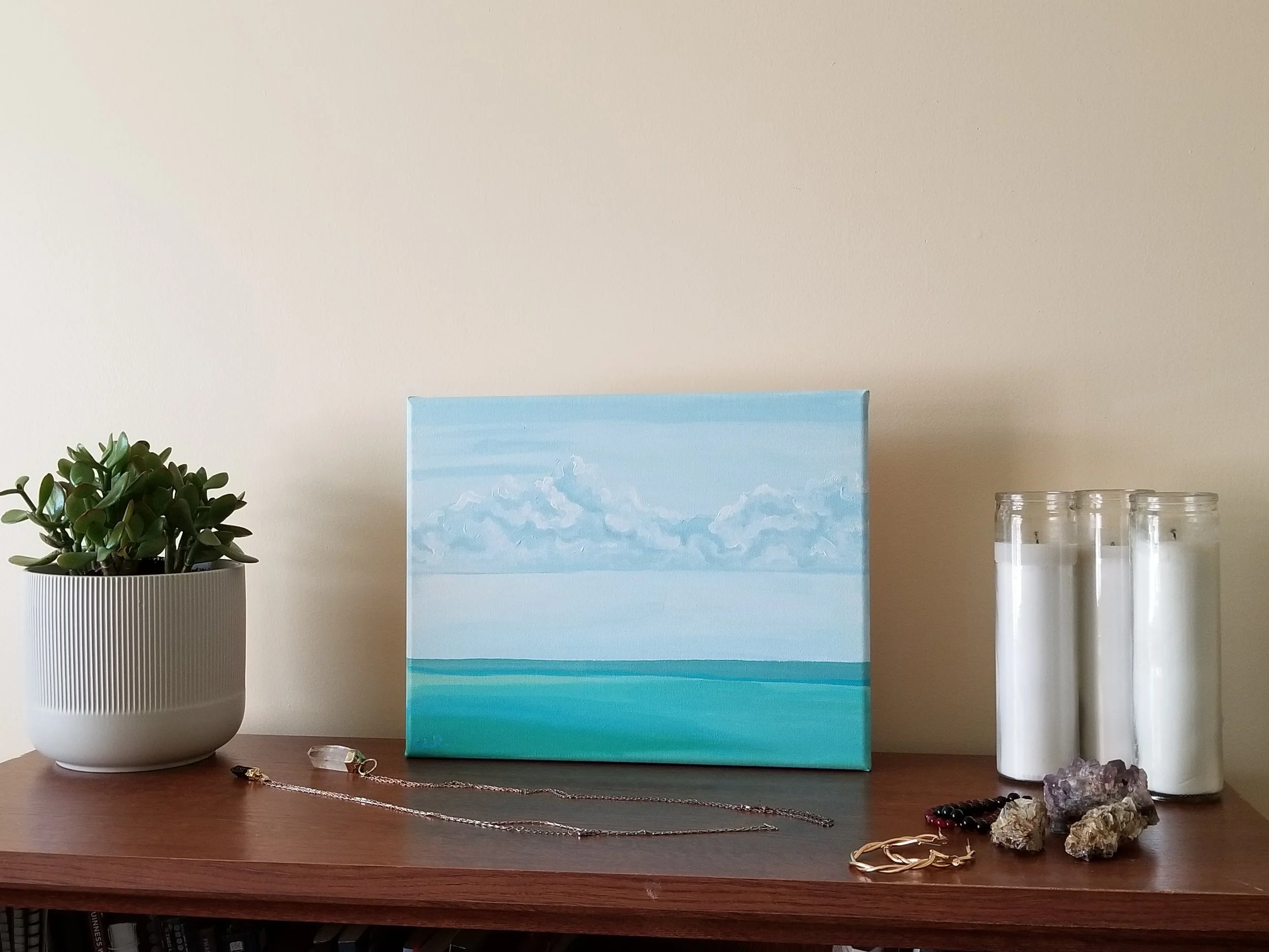 Waikiki Beach II with stone necklaces, earrings, candles, plant.jpg