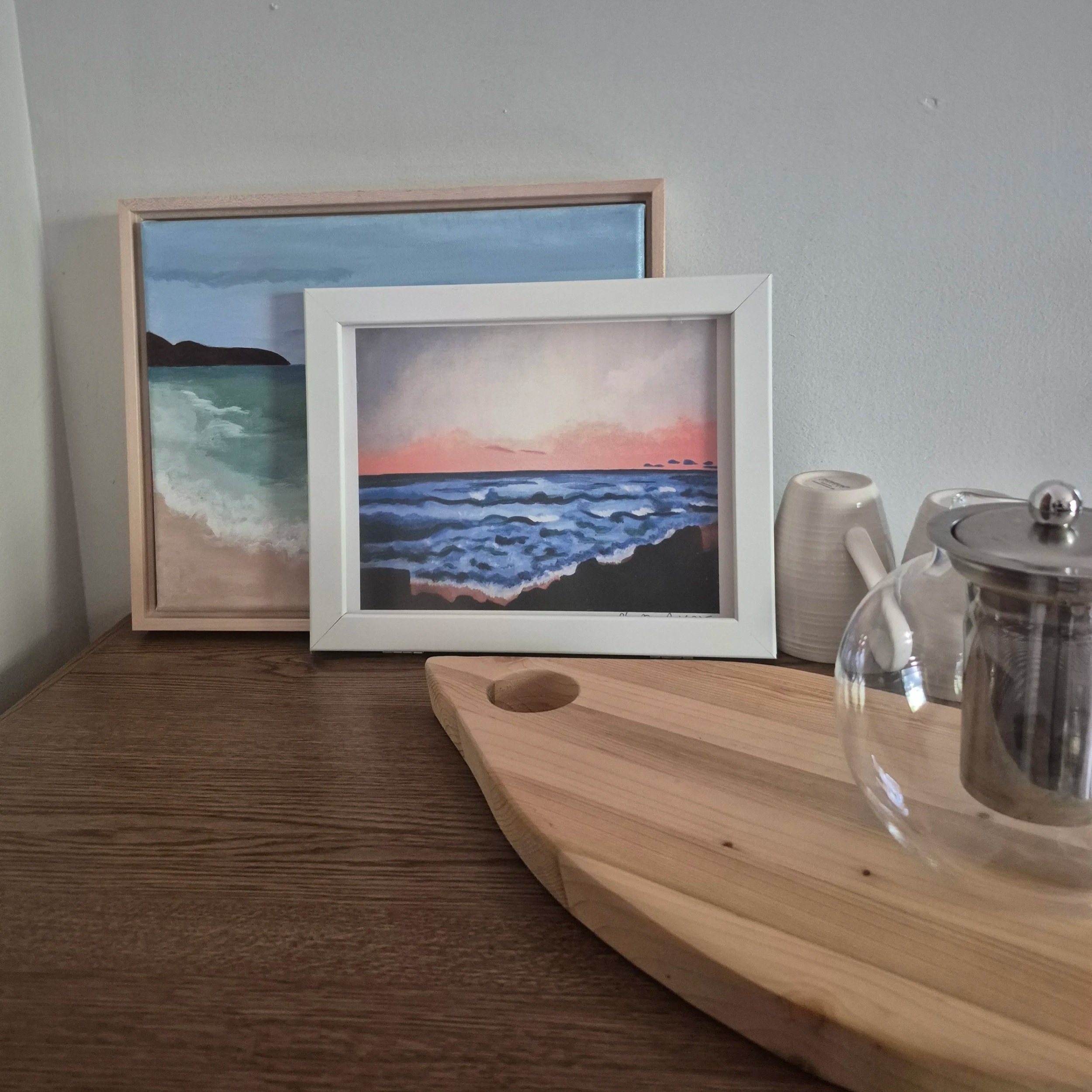 Sunset+at+Germaine%27s+Beach+Print+with+Dark+Water+Painting+and+tea+pot+cutting+board.jpg