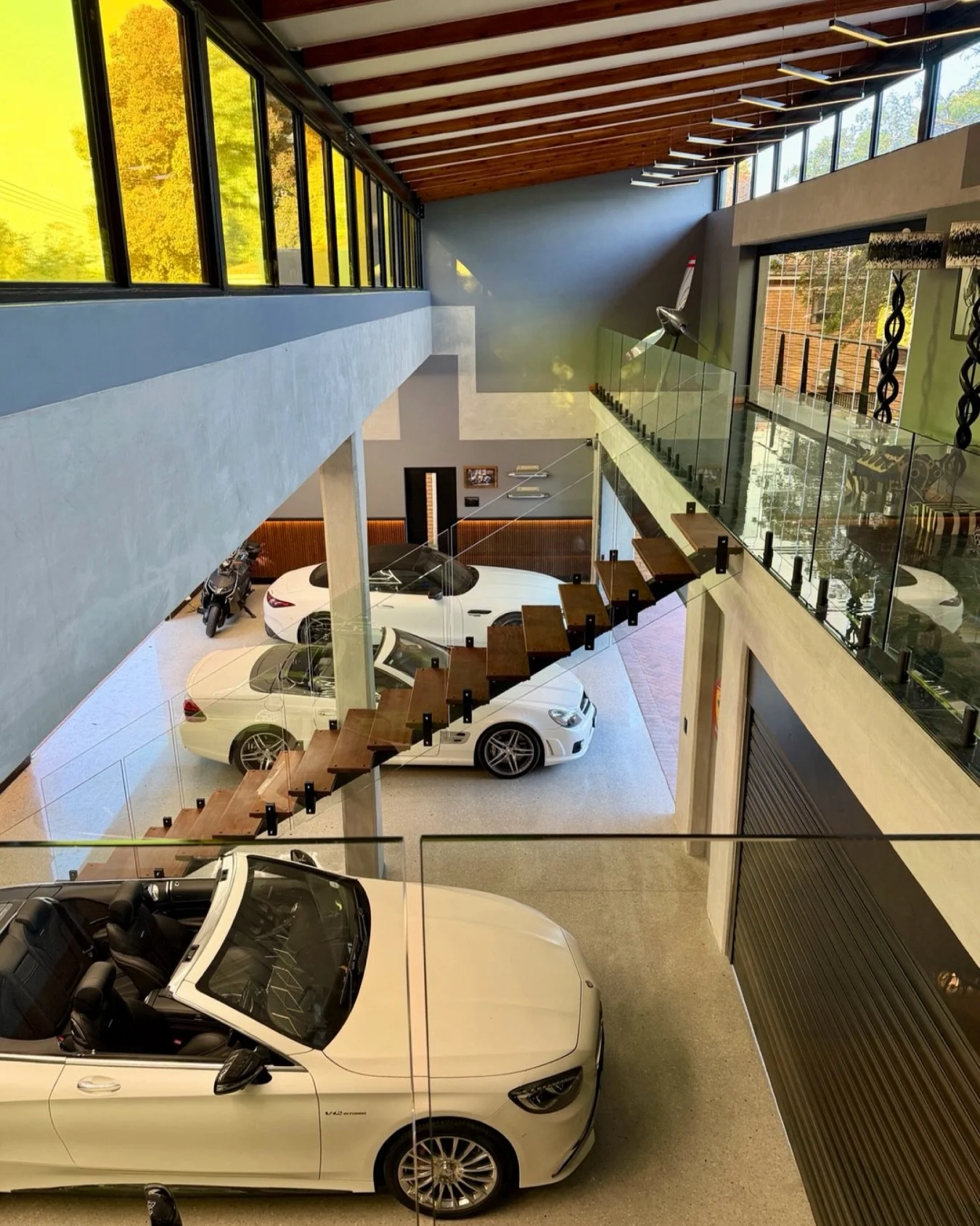 Step into our latest residential garage and man cave &mdash; seamlessly integrated into a full home automation and lighting ecosystem. From the moment the doors glide open, intelligent sensors, ambient lighting, and climate control work in harmony to