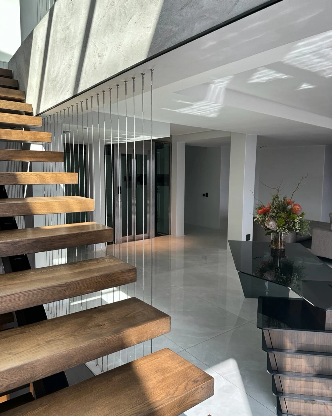 A big home means a lot of light switches &mdash; and a lot of lights left on.
Lighting automation puts every room on one system: one tap for &ldquo;goodnight,&rdquo; pathways that light themselves at 2am, and no more walking the whole house to switch