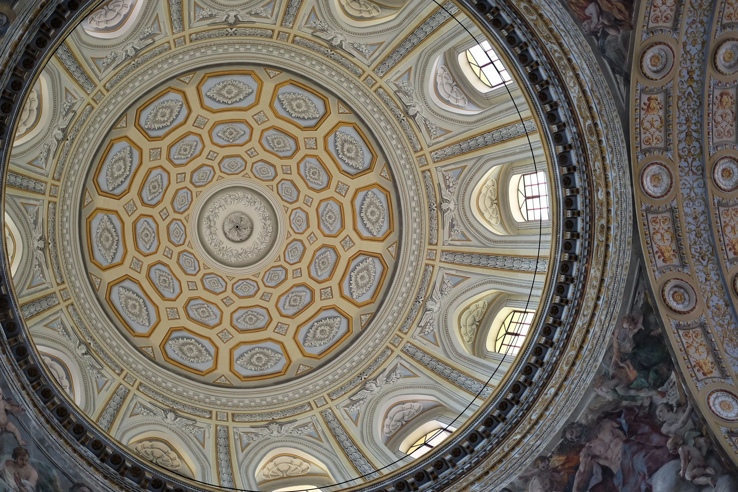 The dome reconstructed after the war, with the frescoes still visible in the corner arches, by Giovanni Lanfranco.