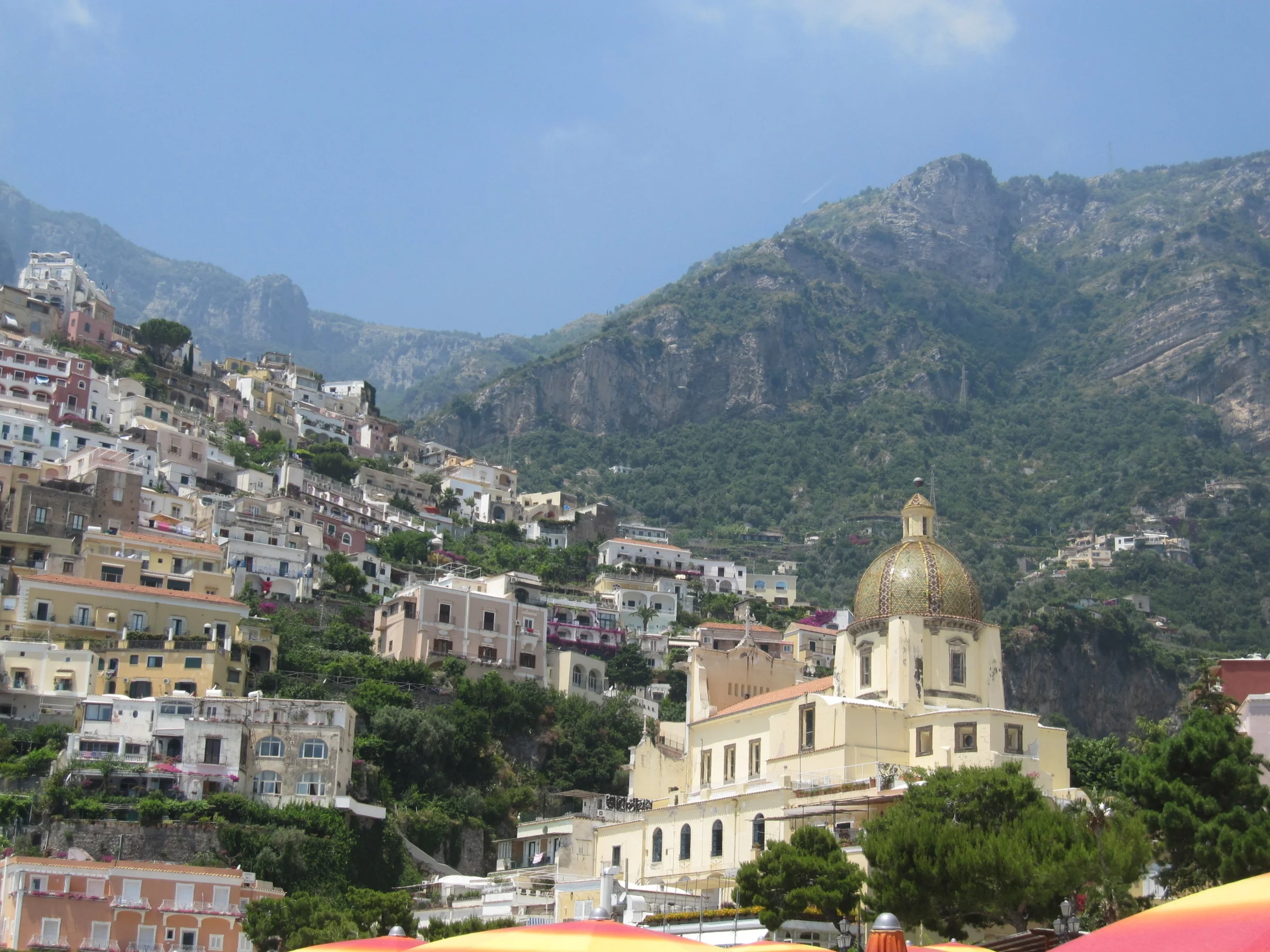 Positano from the beach: the dome of Santa Maria Assunta church.