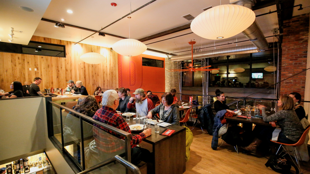The upper mezzanine level provides extra seating, but can also be transformed into a private dining space. The Savant control system can spilt the audio on this level from whats playing below while the AppleTV provides Airplay capability on the Samsung TV for a client to display presentations or slideshows while renting out the space for their event. The restaurant is also currently using this feature for movie nights and game days.