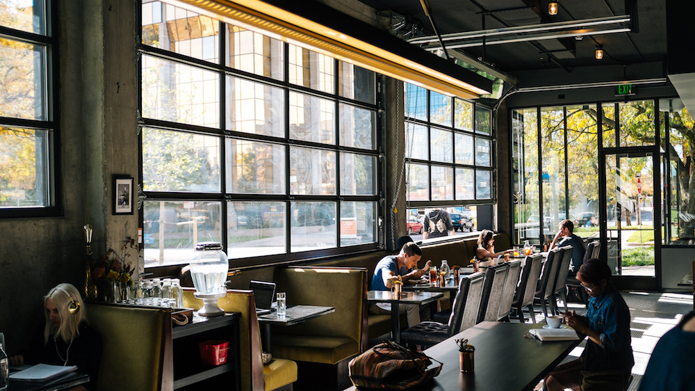 this beautiful coffee shop is wide open to customers for most of Denver's 300 days of sunshine. In the winter months the garage doors close to keep everyone warm as they sip on coffee and eat the creative cafe food. The RTI control system ca
