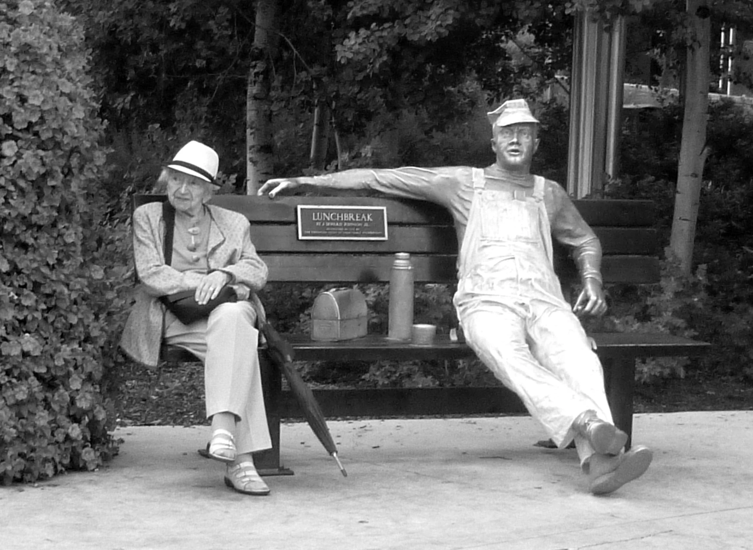 Bench, sculpture and woman, Edmonton, Alberta