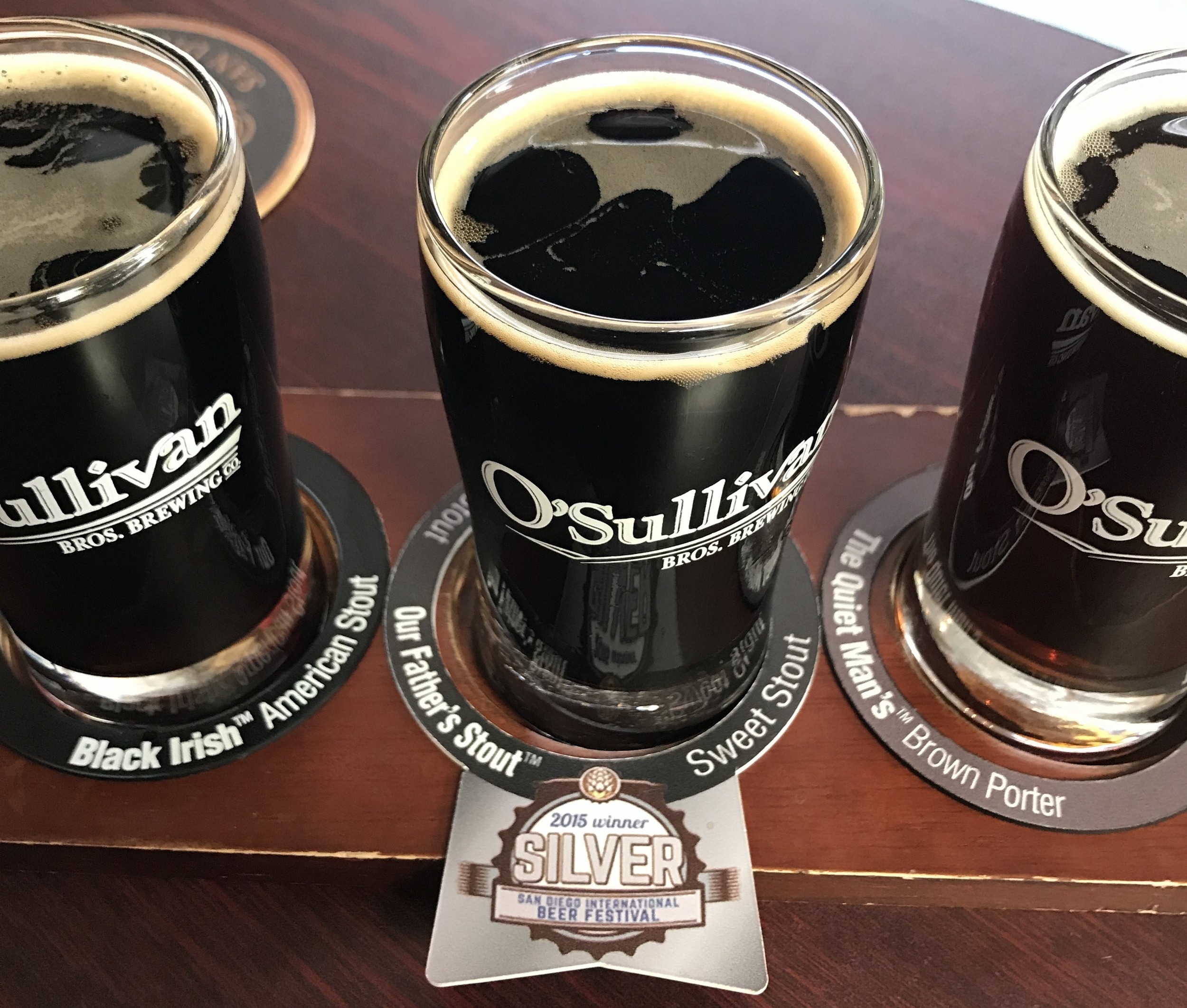 The flight trays are fitted with little rings that name each beer. That might be the biggest advance in flight service since the invention of wooden trays with cups in them.