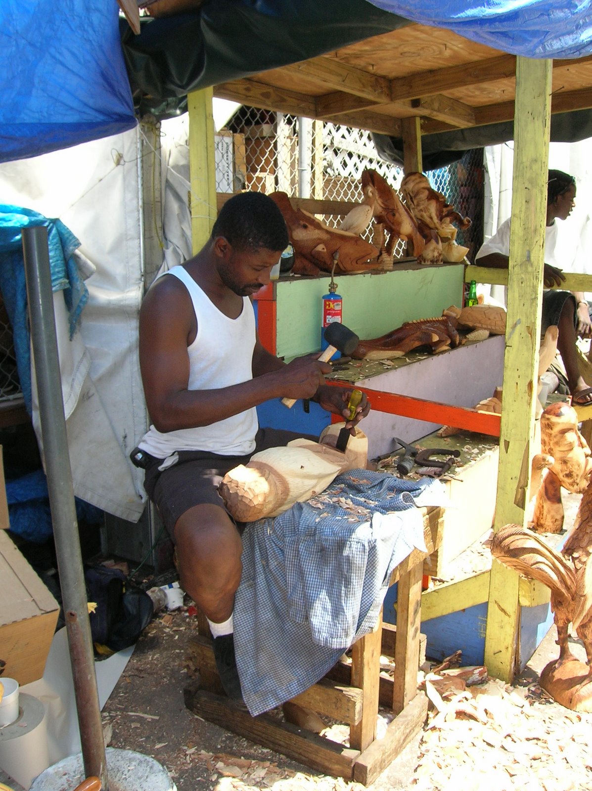 Wood Carver Nassua Straw Market.JPG