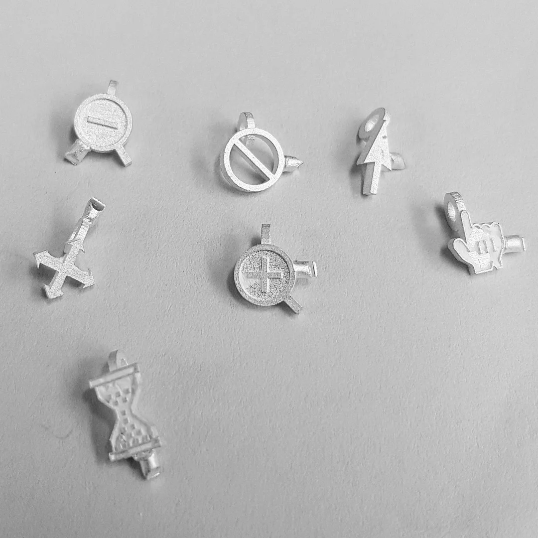 cursor necklace pendants freshly cast.JPG