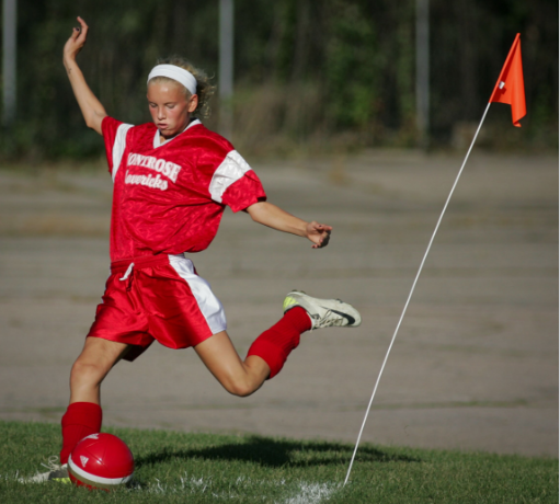 Taking a corner kick on the soccer field; Elizabeth was an avid athlete.