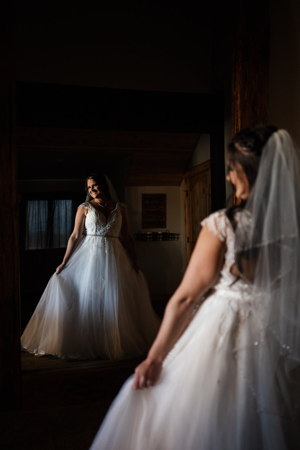 Bride at Camelot Ranch in Billings, Montana looks at self.