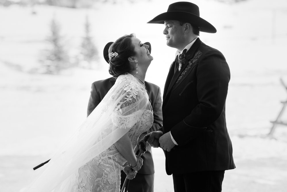 Western wedding, saying vows in front of mountains. 