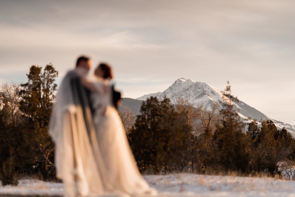Beautiful wedding photo of couple kissing out west