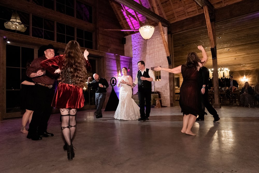 Western guests dance at wedding.