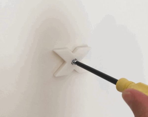 Tip: Now is a good time to use a level for making any minor adjustments so that the Small X Mount is perfectly straight.