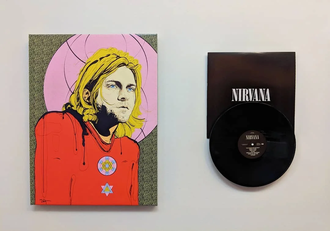 Shout out to coolblueweb for sharing this beautiful setup on their office wall – an ode to Nirvana’s Kurt Cobain.