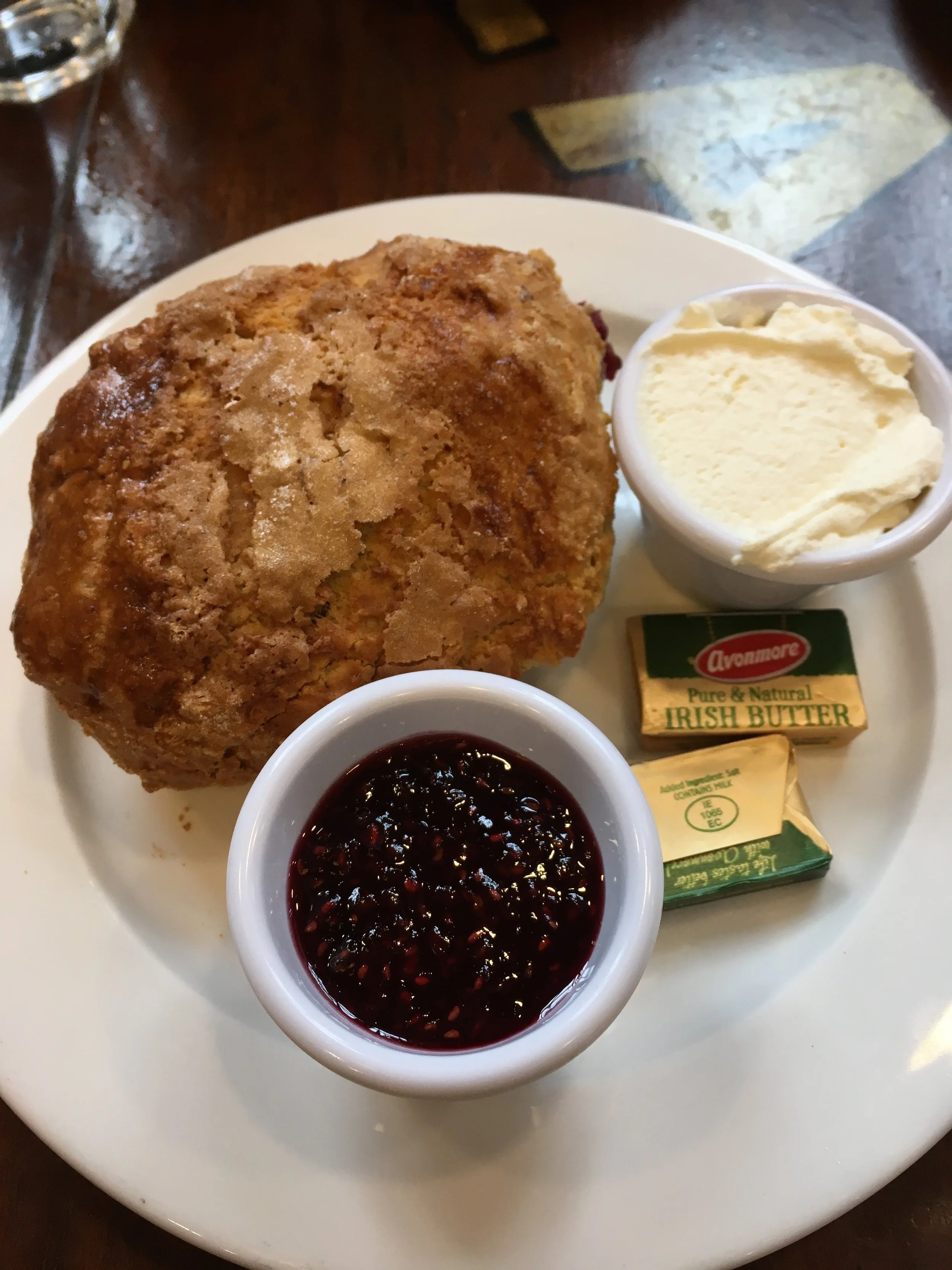Mixed berry scone with homemade jam and clotted cream
