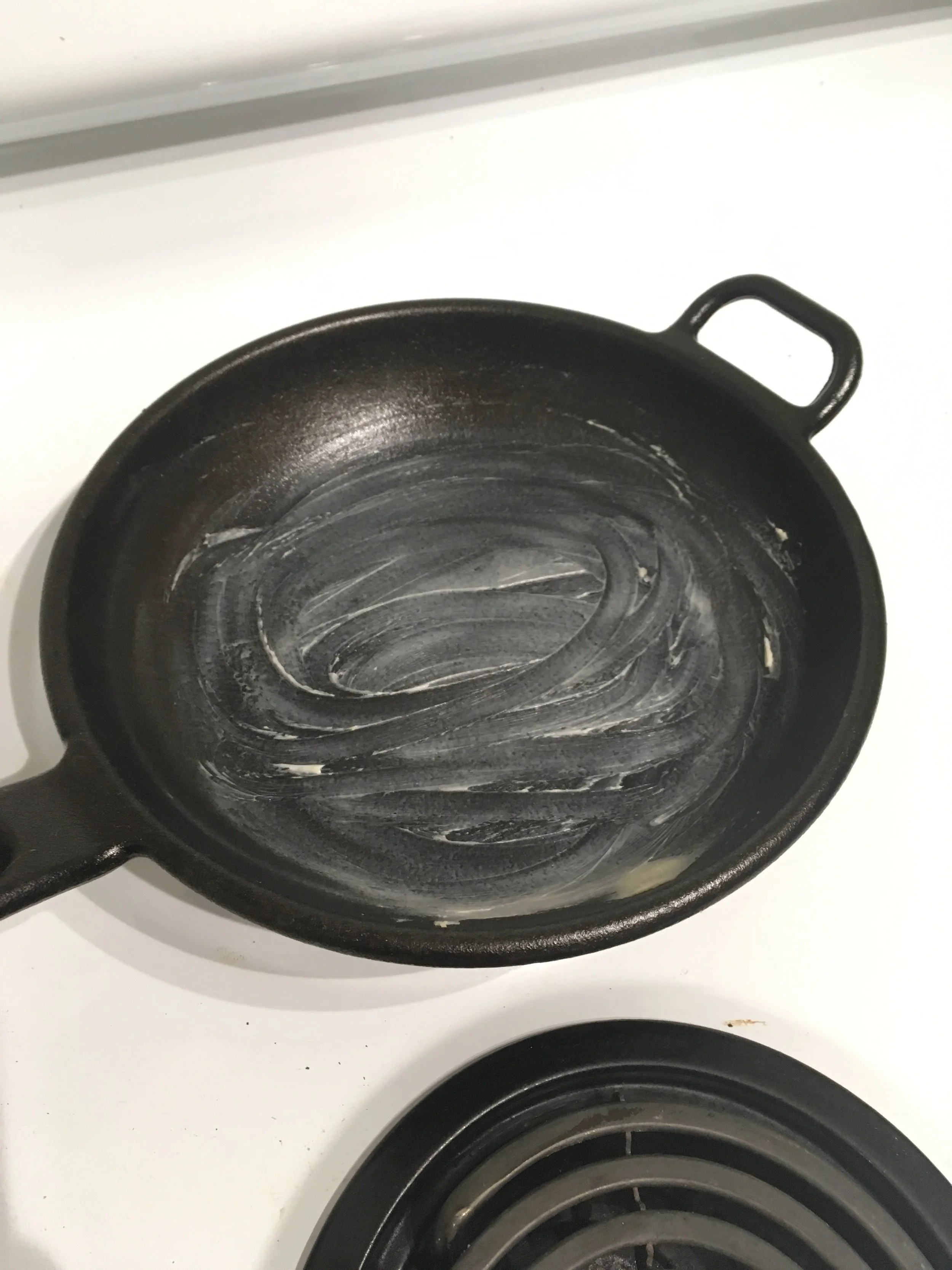 Buttered cast-iron pan