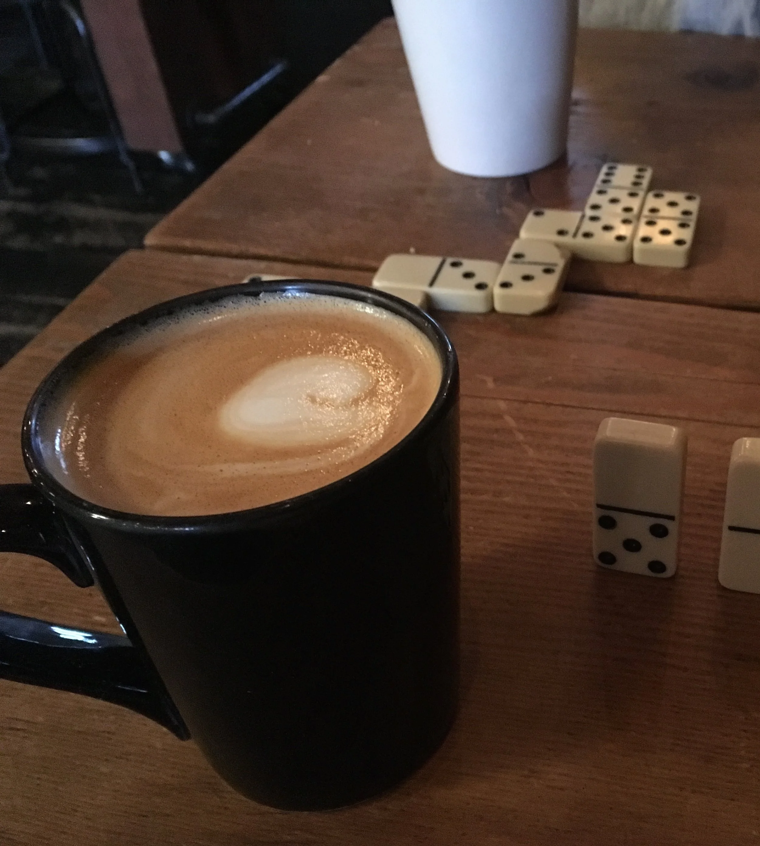Enjoying my maple latte over a game of dominos
