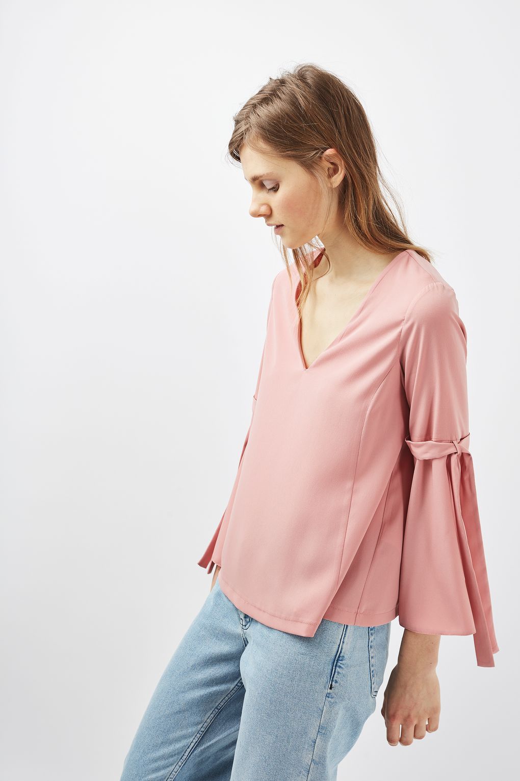 Check out this option from TOPSHOP 'Tie Sleeve Blouse' $60,