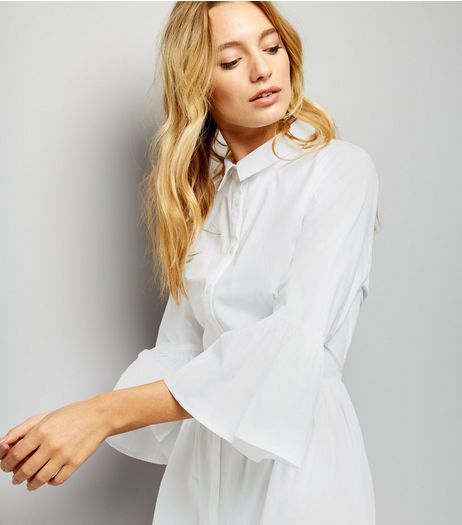 Check out this option from NEW LOOK , 'White Bell Sleeve Cotton Shirt Dress' 22.99