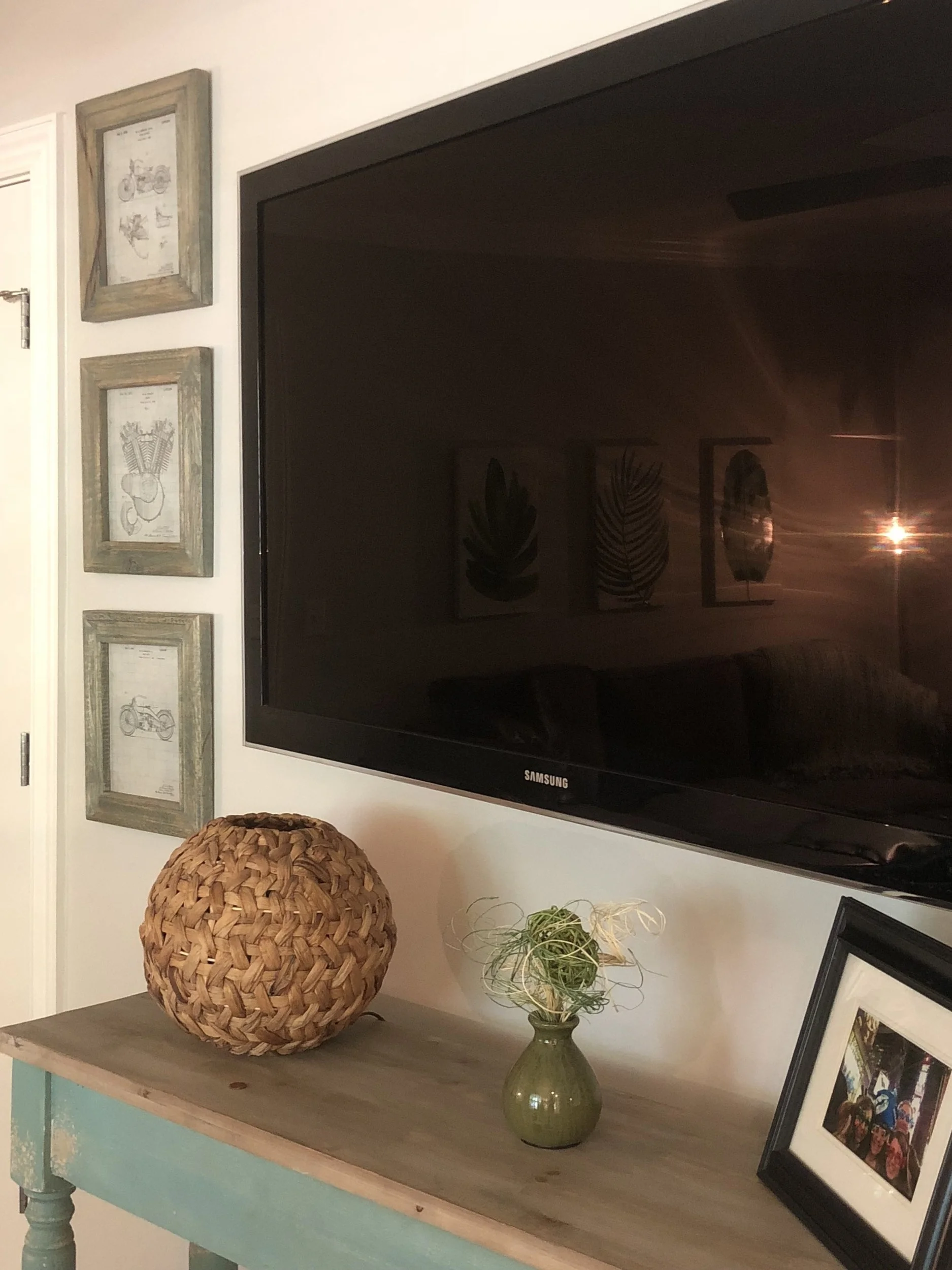 The homeowners' love of Harley Davidson Motorcycles was incorporated by displaying his valued Harley ornament collection and transforming unique Harley Davidson Motorcycle Blueprints into art.