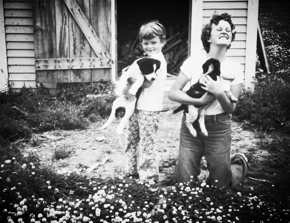 Valerie and Sharon, on a childhood summer vacation, clearly showing an early (and lifelong) enthusiasm for dogs.