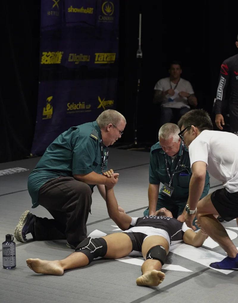 UFC vet Caol Uno refuses to tap to a rear naked choke from Vitor 'Shaolin' Ribeiro and passes out – Japanese MMA star and and grappling virtuoso Shinya Aoki rushes to his side. Aoki meanwhile fights Ben Askren under Japanese rules in November 2017. Photo by Andrew Jackson.